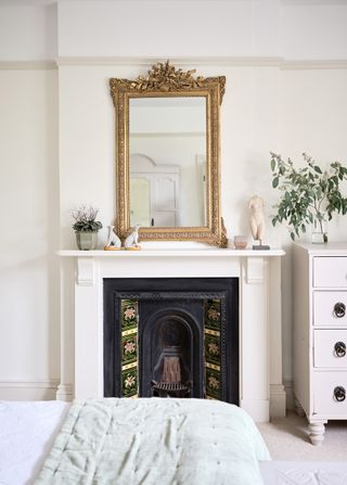 Fireplace tiles on fireplace in neutral bedroom