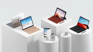 A selection of Microsoft hardware products sitting on white cylindrical pedestals