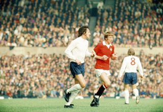 Wyn Davies (middle, in red) in action for Manchester United against Derby County in September 1972.