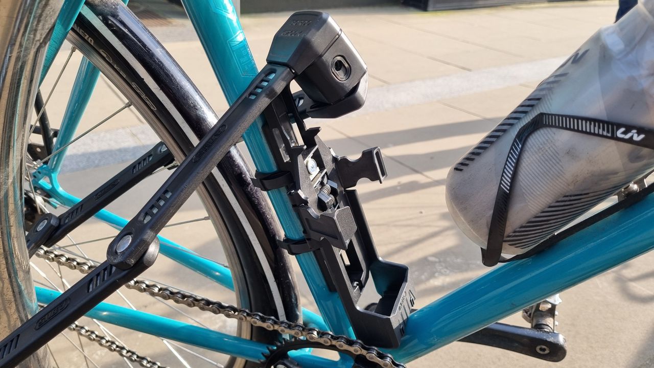 The bracket of the Abus Bordo 6200K lock, mounted to a bike
