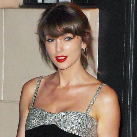 Taylor Swift was spotted after a family dinner in NYC wearing a bejeweled little black dress, matching peep-toe pumps, and her engagement ring