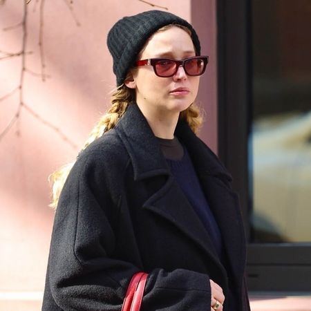 Jennifer Lawrence walks through Manhattan wearing a black wool coat with The Row boat shoes and an Hermes tote