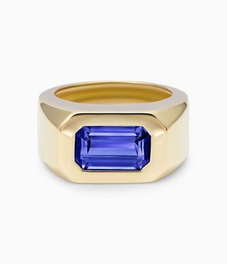 Gold ring with blue stone in middle