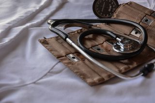 A stethoscope against a white backdrop