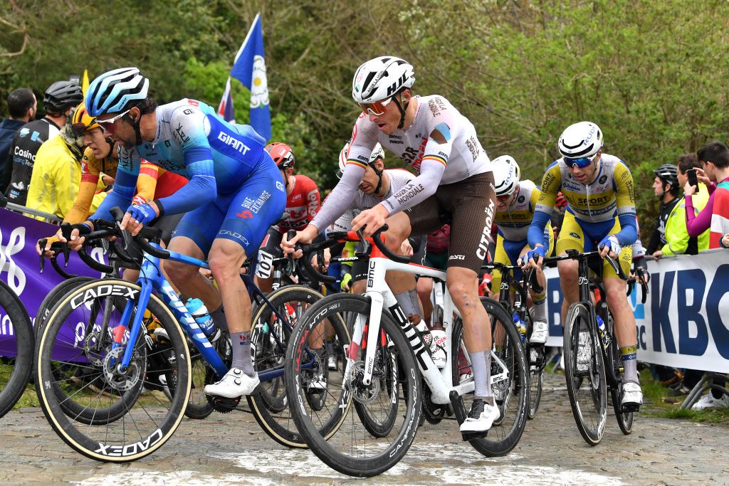 OVERIJSE BELGIUM APRIL 13 LR Michael Matthews of Australia and Team Bikeexchange Jayco and Oliver Naesen of Belgium and AG2R Citren Team compete at Moskesstraat cobblestones sector during the 62nd De Brabantse Pijl La Flche Brabanonne 2022 Mens Elite a 2051km one day race from Leuven to Overijse BP22 on April 13 2022 in Overijse Belgium Photo by Luc ClaessenGetty Images