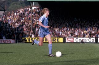 Peter Barnes in action for Manchester City in a game against Norwich City.