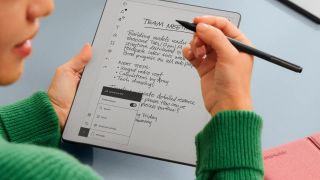 A woman using the reMarkable Paper Pure tablet