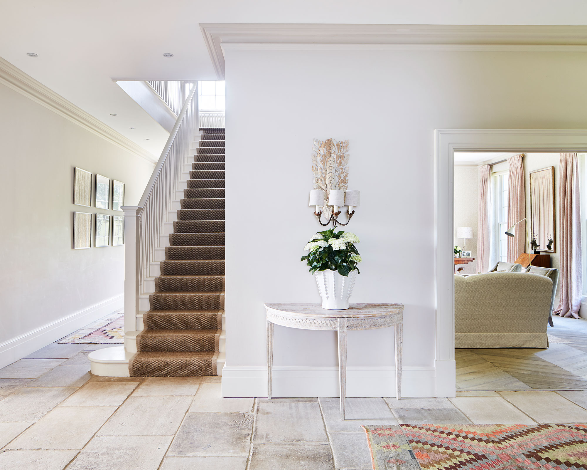 White hallway with flagstone flooring