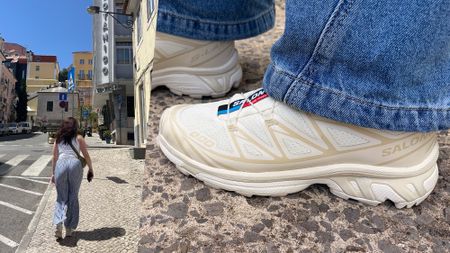 woman wearing Salomon XT-6 sneakers walking up a steep city hill