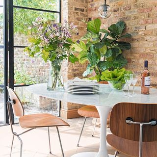 room with stone wall dining table with chairs