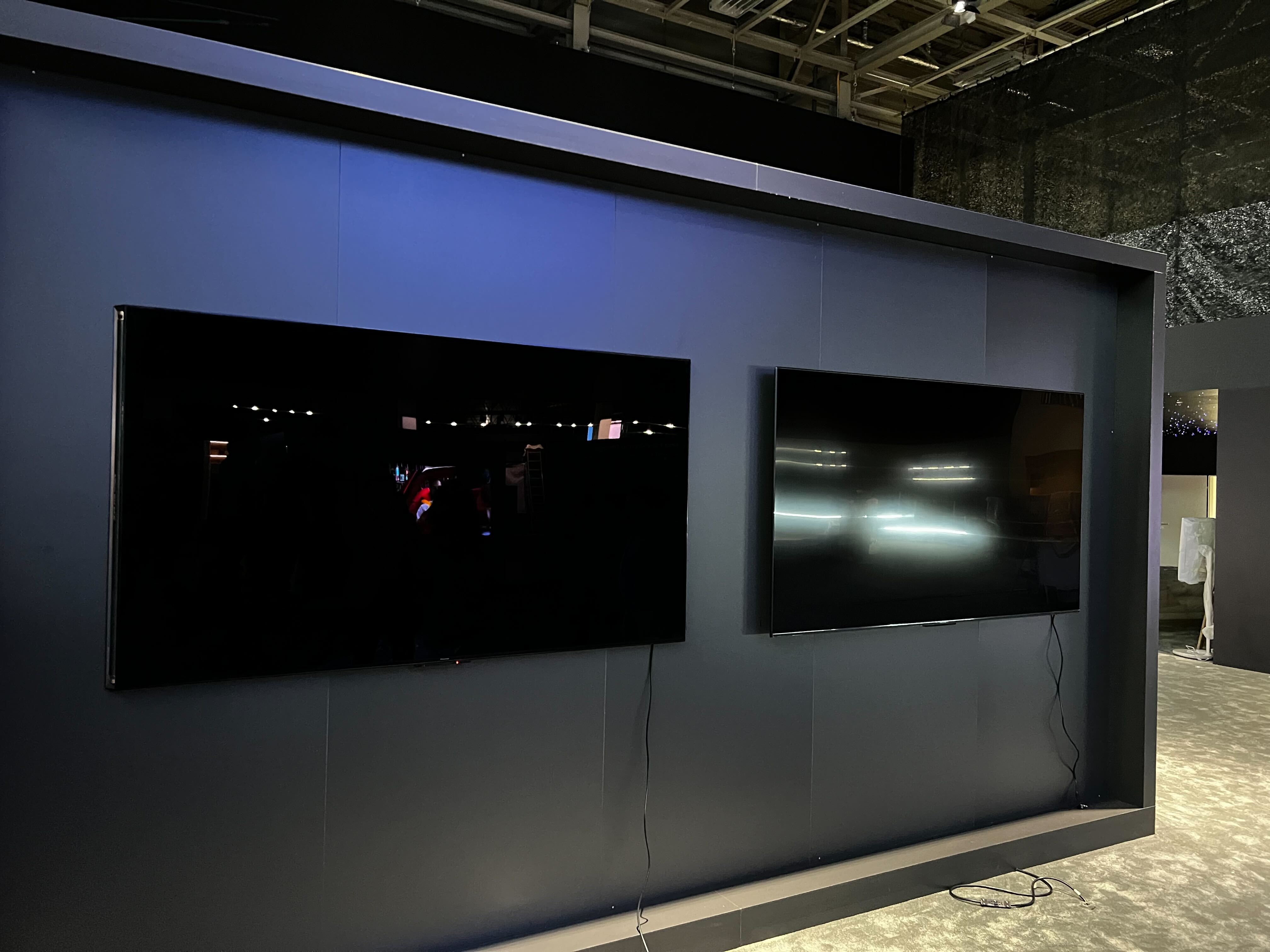 Two TVs on a wall, with one showing new anti-reflective tech