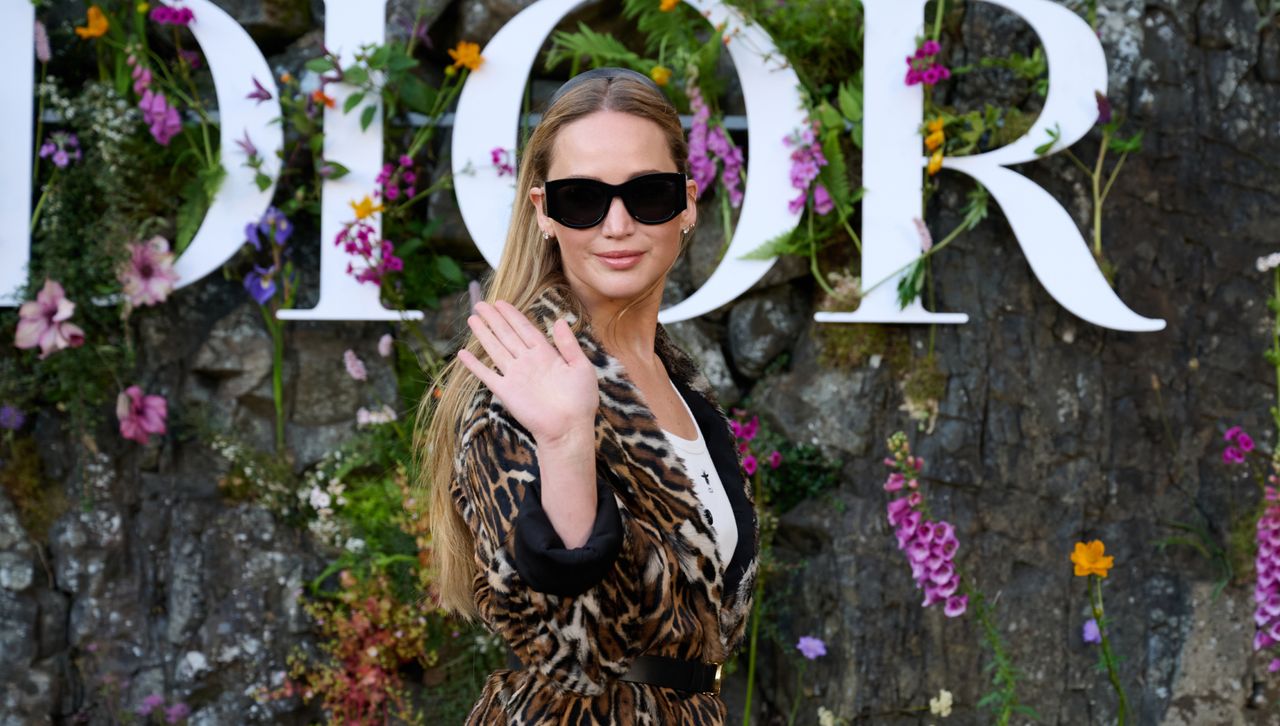 Jennifer Lawrence attends the dior cruise 2025 show wearing a leopard print coat bringing back the leopard print trend