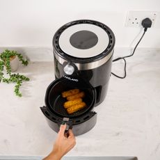 cooking with air fryer on countertop