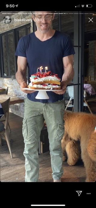 ryan reynolds with a birthday cake