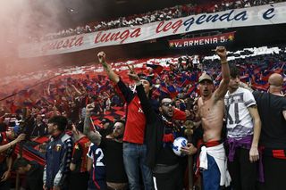 Fans of Genoa cheer their team in a derby against Sampdoria in 2022.