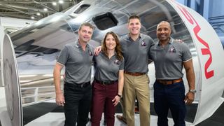 The Artemis 2 crew poses in front of an Orion simulator Jan. 23, 2026 at NASA's Johnson Space Center in Houston. From left: Reid Wiseman, Christina Koch, Jeremy Hansen and Victor Glover.