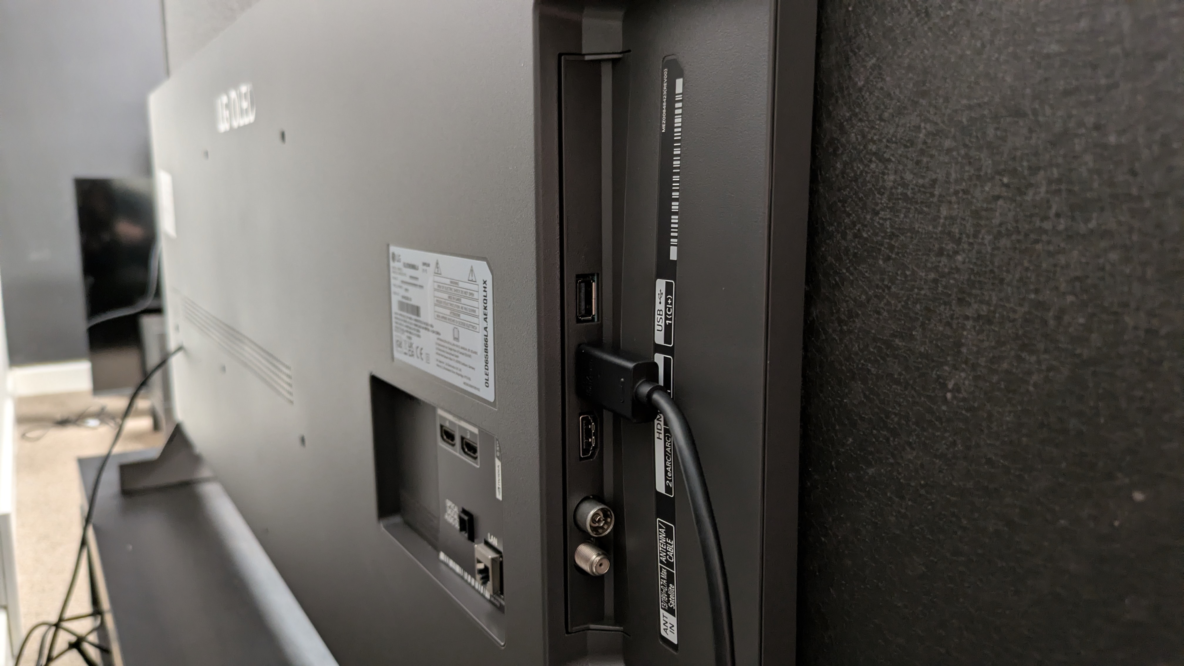 LG B6 OLED TV ports, showing a HDMI cable in HDMI port 1