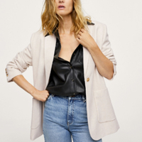 Flecked Wool-Blend Blazer | Mango
This simple straight design will give floaty frocks a boyish spin. Keep the look tonal and wear with browns, whites, and creams.