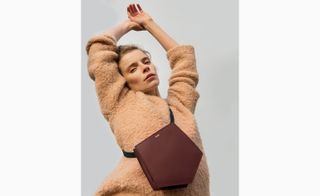 Model wearing vineyard wine box style bag