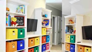 DIY entertainment centre with colourful storage boxes IKEA Billy bookcase hack