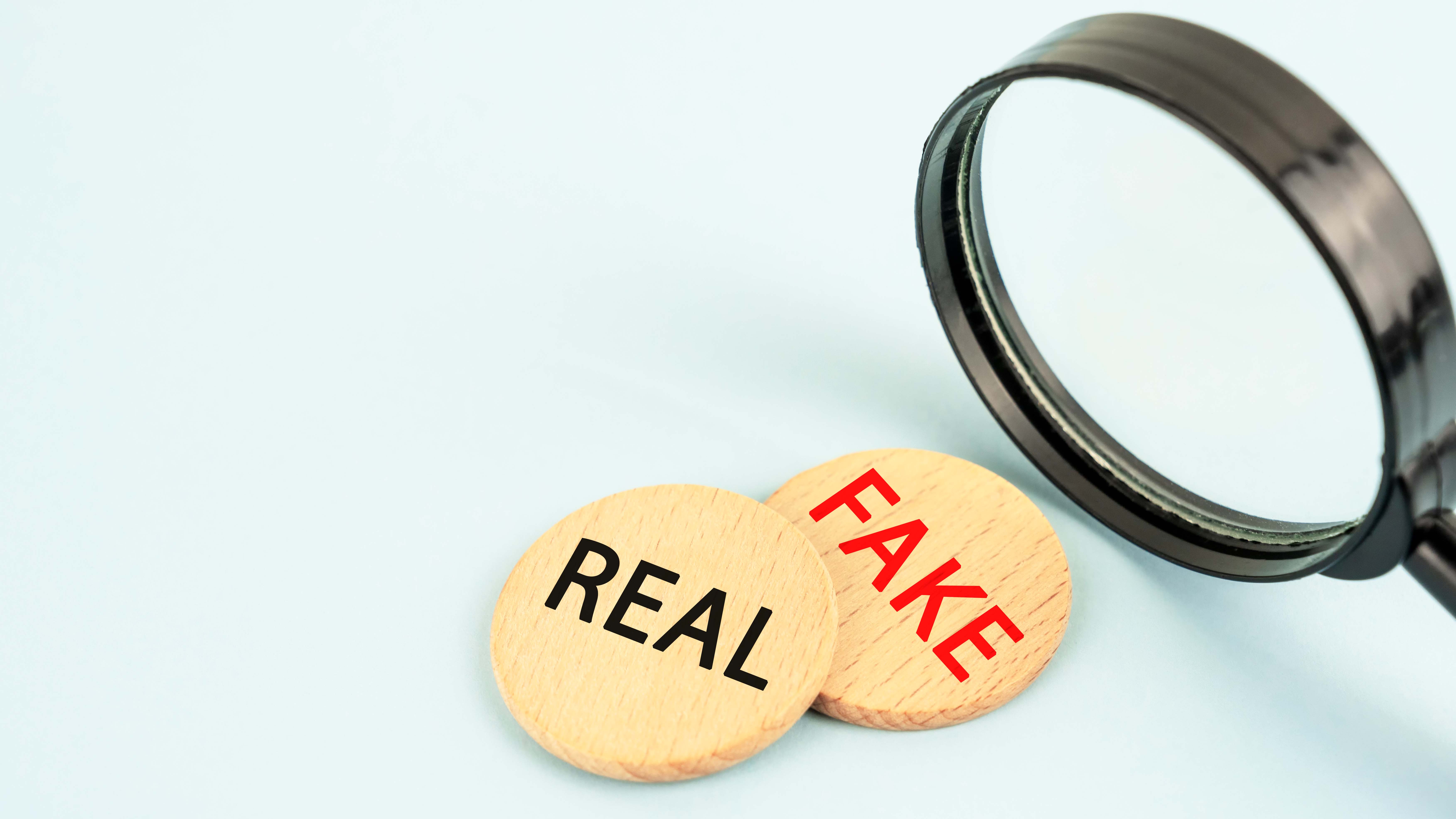 Fake and real tokens under a magnifying glass