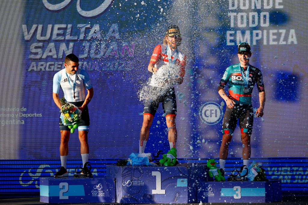 SAN JUAN ARGENTINA JANUARY 24 LR Maximiliano Richeze of Argentina and Team Argentina on second place stage winner Quinn Simmons of The United States and Team Trek Segafredo and Sam Bennett of Ireland and Team Bora Hansgrohe on third place pose on the podium ceremony after the 39th Vuelta a San Juan International 2023 Stage 3 a 1709km stage from Circuito San Juan Villicum to Circuito San Juan Villicum VueltaSJ2023 on January 24 2023 in San Juan Argentina Photo by Maximiliano BlancoGetty Images