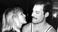 British singer, songwriter and record producer Freddie Mercury (1946 - 1991) of British rock band Queen with his friend Mary Austin