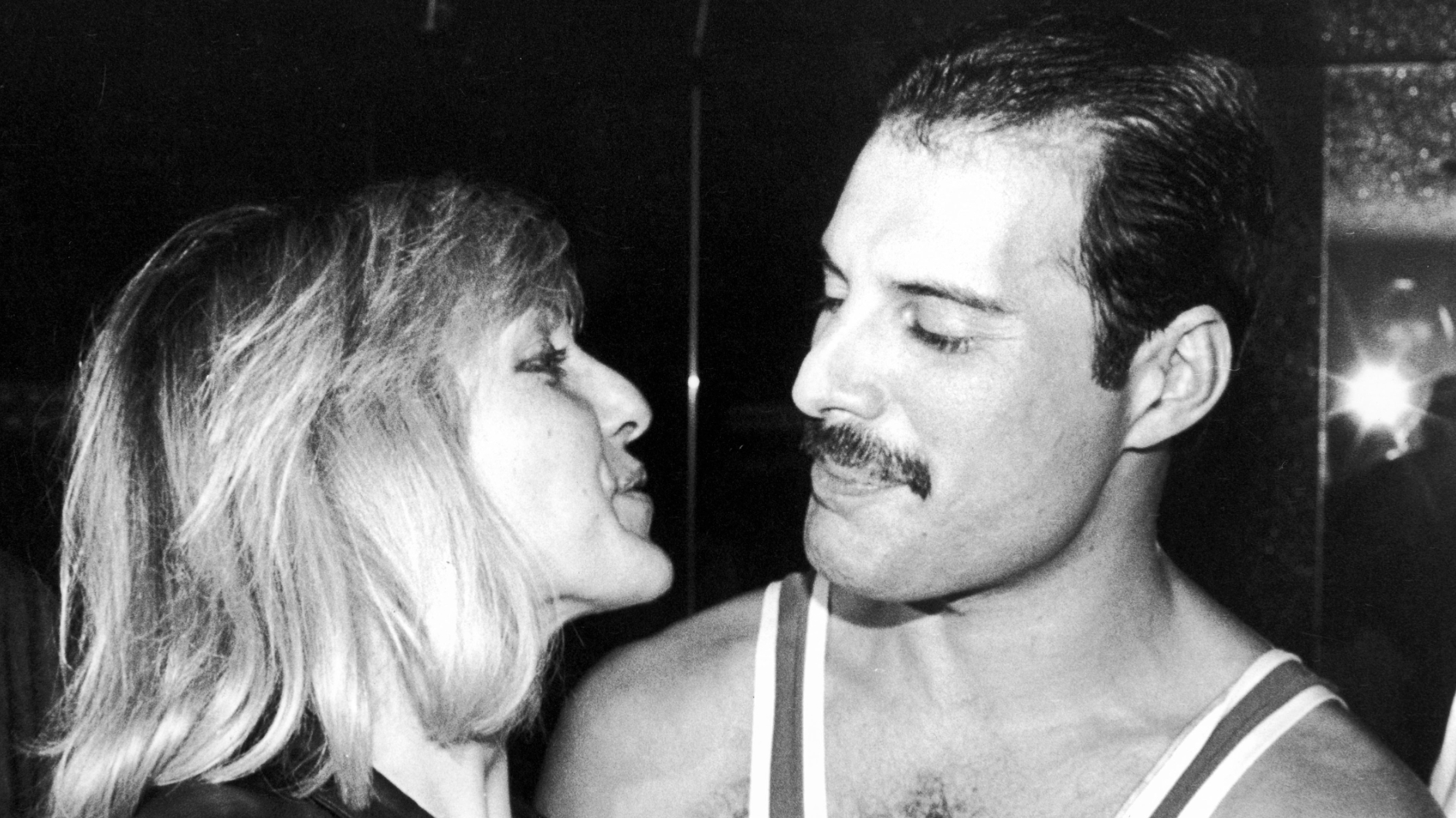 British singer, songwriter and record producer Freddie Mercury (1946 - 1991) of British rock band Queen with his friend Mary Austin