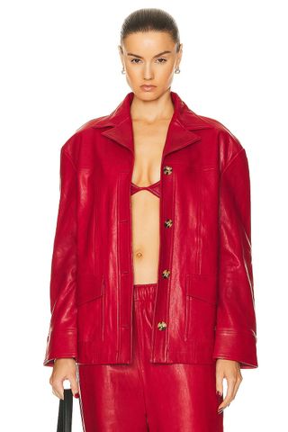 a model wears a red leather jacket