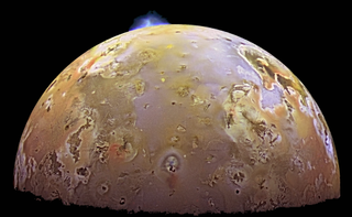 A volcanic eruption on Jupiter's moon Io.