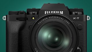 The Fujifilm X-T4 camera on a green background