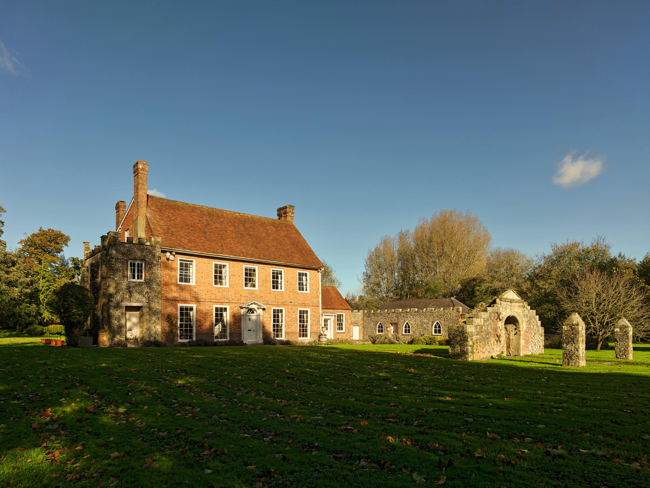 Fig 1: The entrance façade. In the foreground to the right is the ruined Jacobean gateway that was erected as a Picturesque feature.