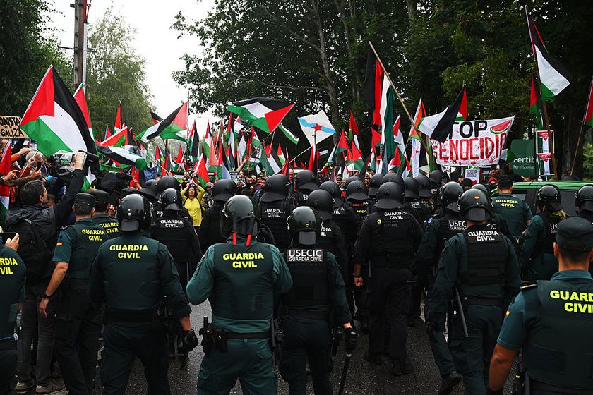 Pro-Palestinian demonstrators are suppressed by the police during the La Vuelta - 80th Tour of Spain 2025, Stage 16 a 167.9km stage from Poio to Mos. Castro de Herville / The stage ends 8km before the actual finish line due to protests / on September 09, 2025 in Castro de Erville, Spain. (Photo by Dario Belingheri/Getty Images)