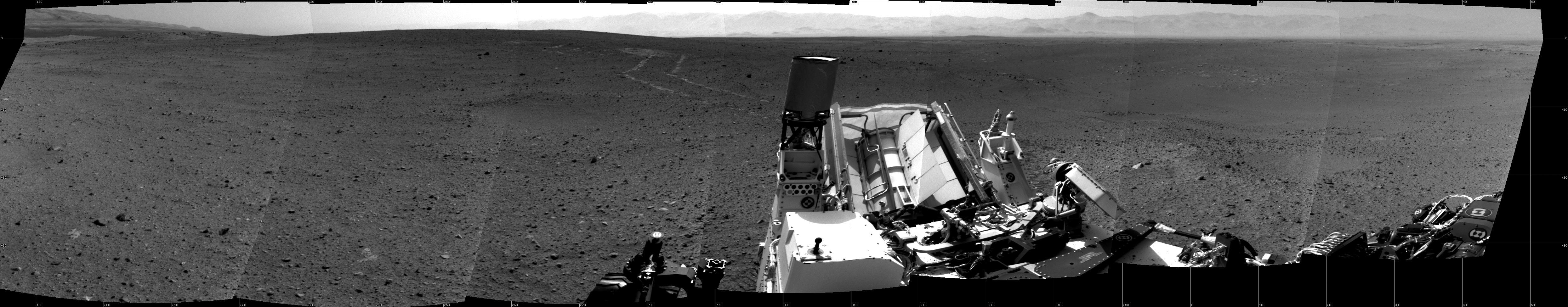 NASA&#039;s Mars rover Curiosity looks back at tracks on Mars after drive on Aug. 30, 2012.