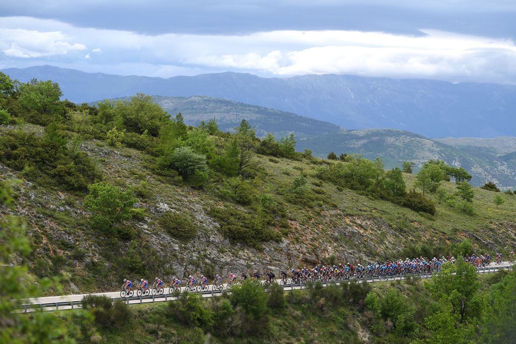 CAMPO FELICE ROCCA DI CAMBIO ITALY MAY 16 Rudy Molard of France Matteo Badilatti of Switzerland Antoine Duchesne of Canada Simon Guglielmi of France Romain Seigle of France Sebastien Reichenbach of Switzerland Attila Valter of Hungary Pink Leader Jersey Lars Van Den Berg of Netherlands and Team Groupama FDJ lead The Peloton passing through Aldeno 194m during the 104th Giro dItalia 2021 Stage 9 a 158km stage from Castel di Sangro to Campo Felice Rocca di Cambio 1665m Landscape Mountains girodiitalia Giro UCIworldtour on May 16 2021 in Campo Felice Rocca di Cambio Italy Photo by Tim de WaeleGetty Images