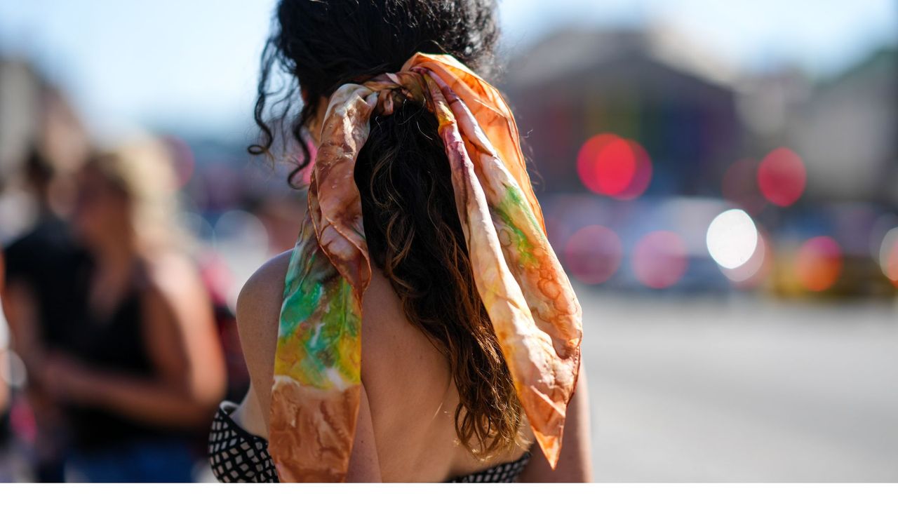 Easy hairstyles: woman wearing a scarf in her ponytail