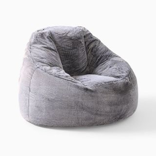 A gray faux fur bean bag-like chair for sustainable furniture brands.