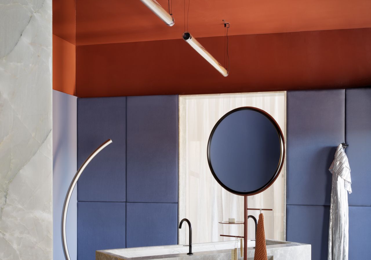 A bathroom with a red ceiling in gloss finish