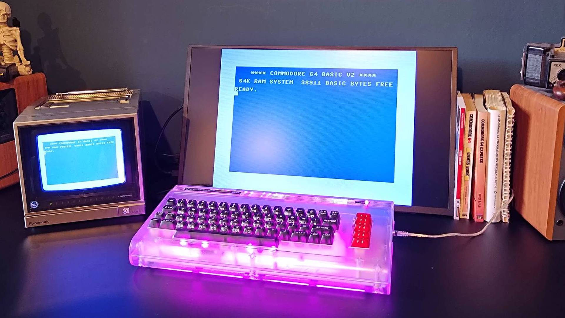 Commodore 64 Ultimate connected to Uperfect portable monitor and Panasonic CRT TV with purple RGB lights.