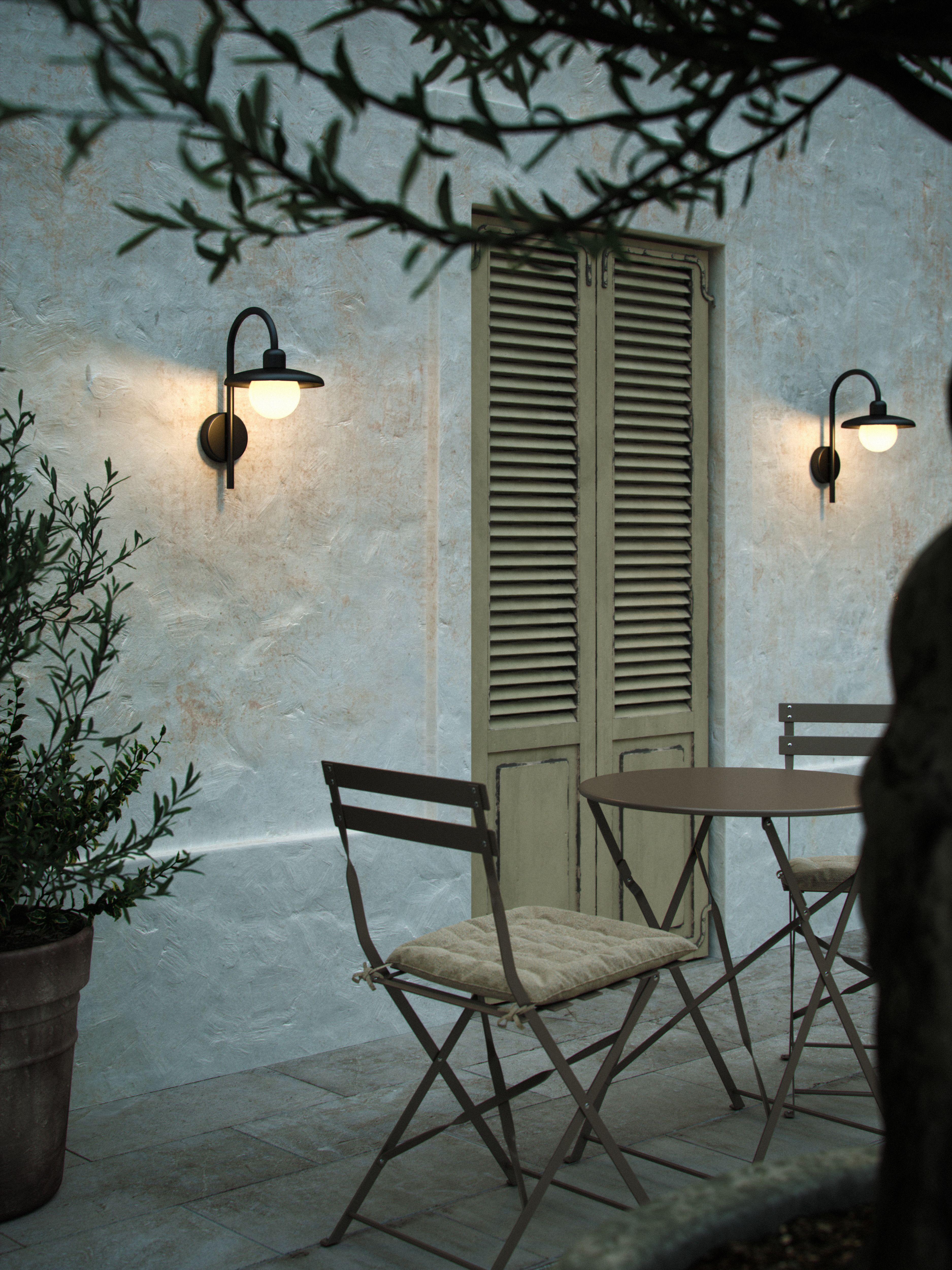 two black outdoor wall lights either side of a louvred door