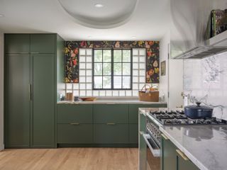 A kitchen with glass block and steel windows