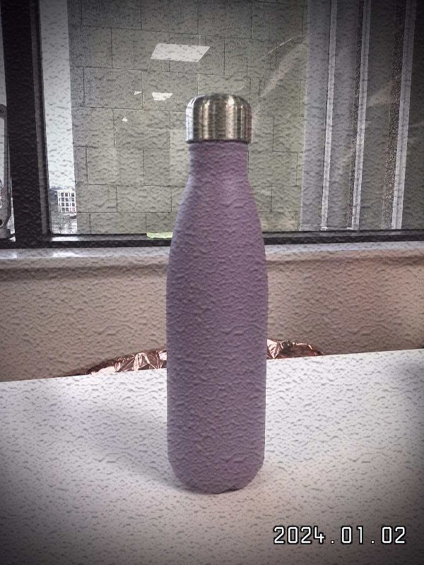 A purple Chillys bottle shot on the Leica Sofort 2