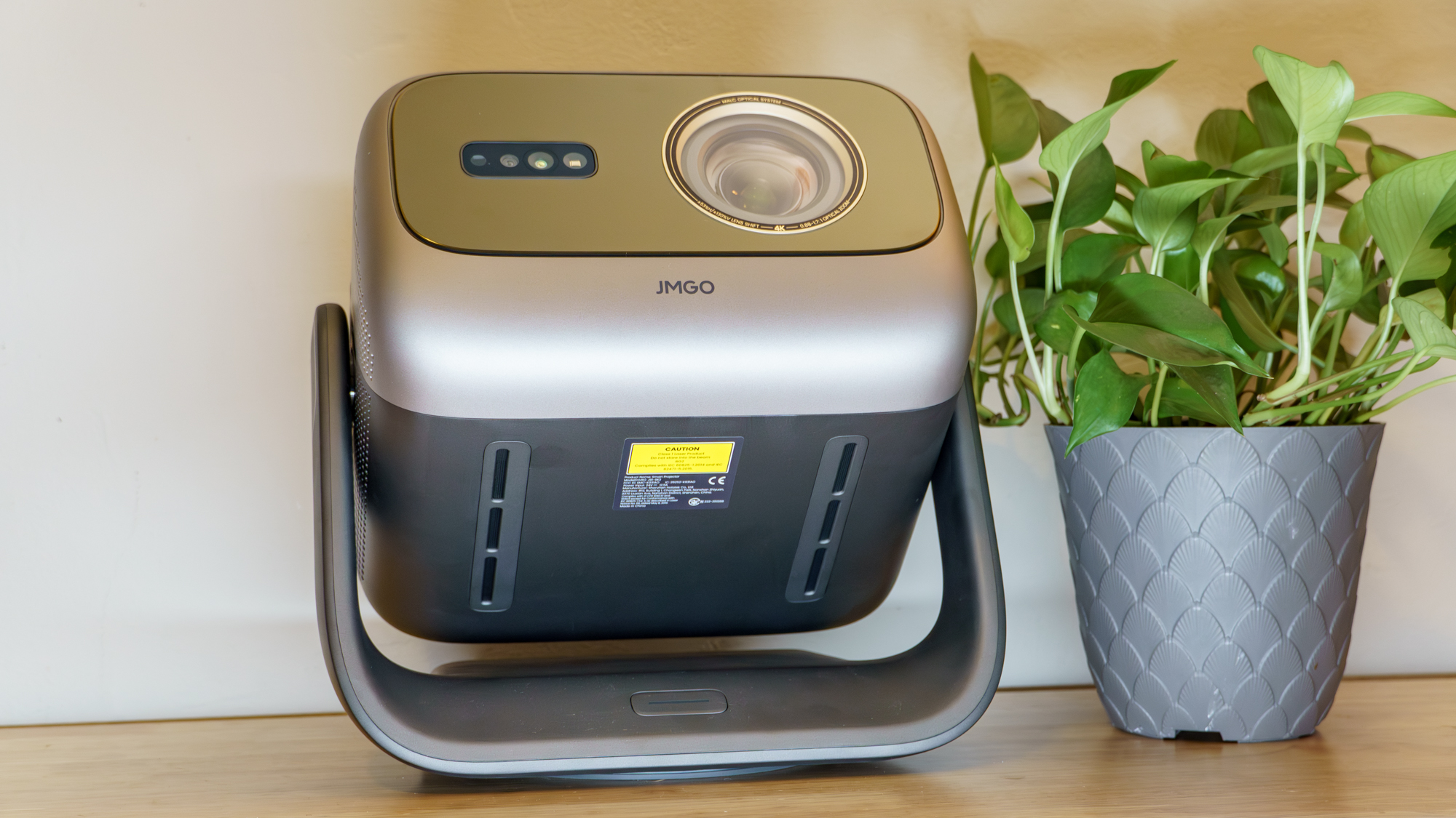 A JMGO N3 Ultimate projector on a desk