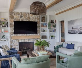 Living room with a fireplace by Robin Gannon Interiors