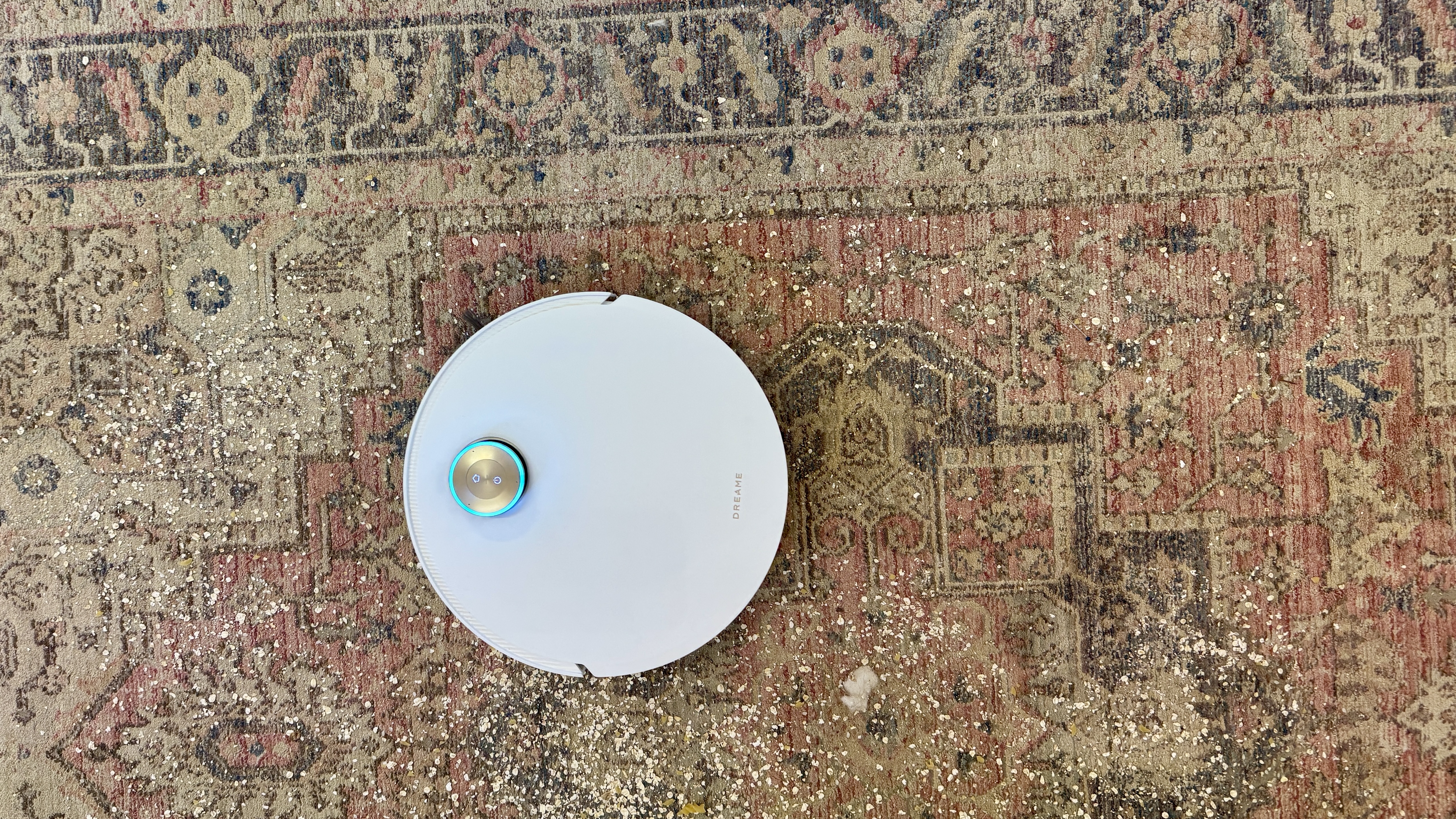 Dreame Matrix10 Ultra robot vacuum cleaning debris from a large rug