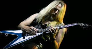 Richie Faulkner live onstage with Judas Priest, playing his signature GIbson Flying V