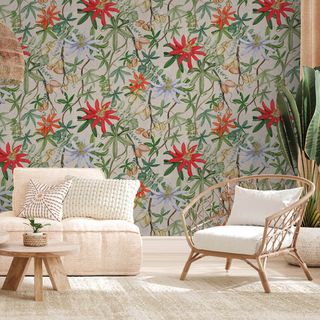 vibrant botanical wallpaper in white living room with rattan armchair