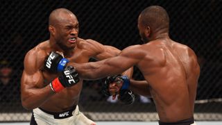 Leon Edwards punches Kamaru Usman in their welterweight bout during the UFC Fight 