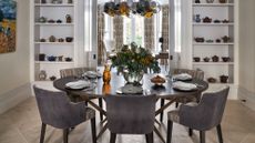 Dining room ideas with shelving and velvet grey chairs