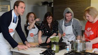 Prince William helps with a cookery lesson at the Centrepoint support centre